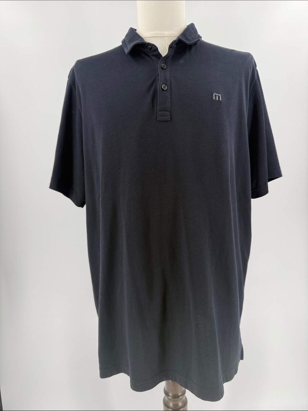 Travis Mathew Men's Black Polo with Subtle Embroidered 'M'